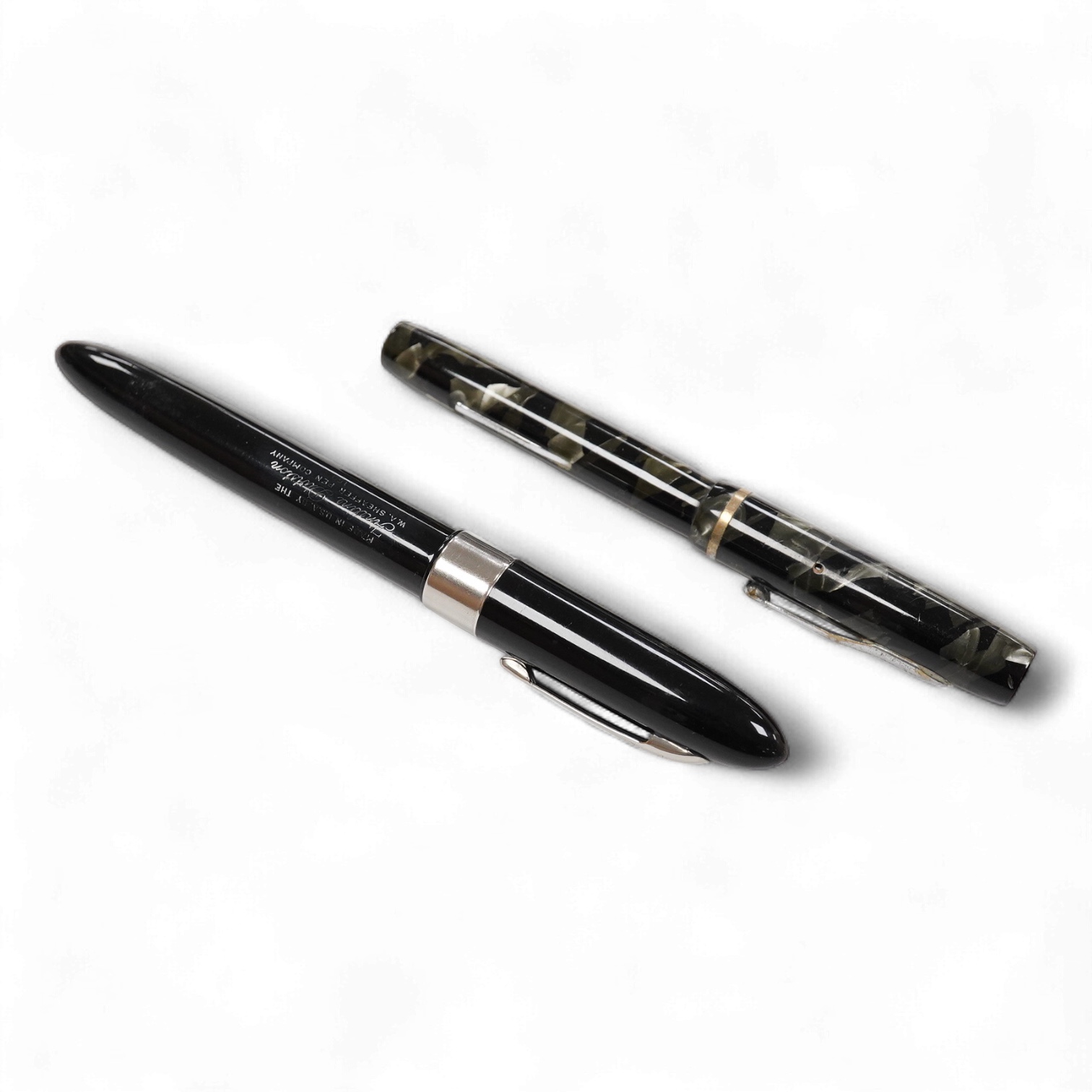 A pair of Sheaffer lever filled pens with nickel trim